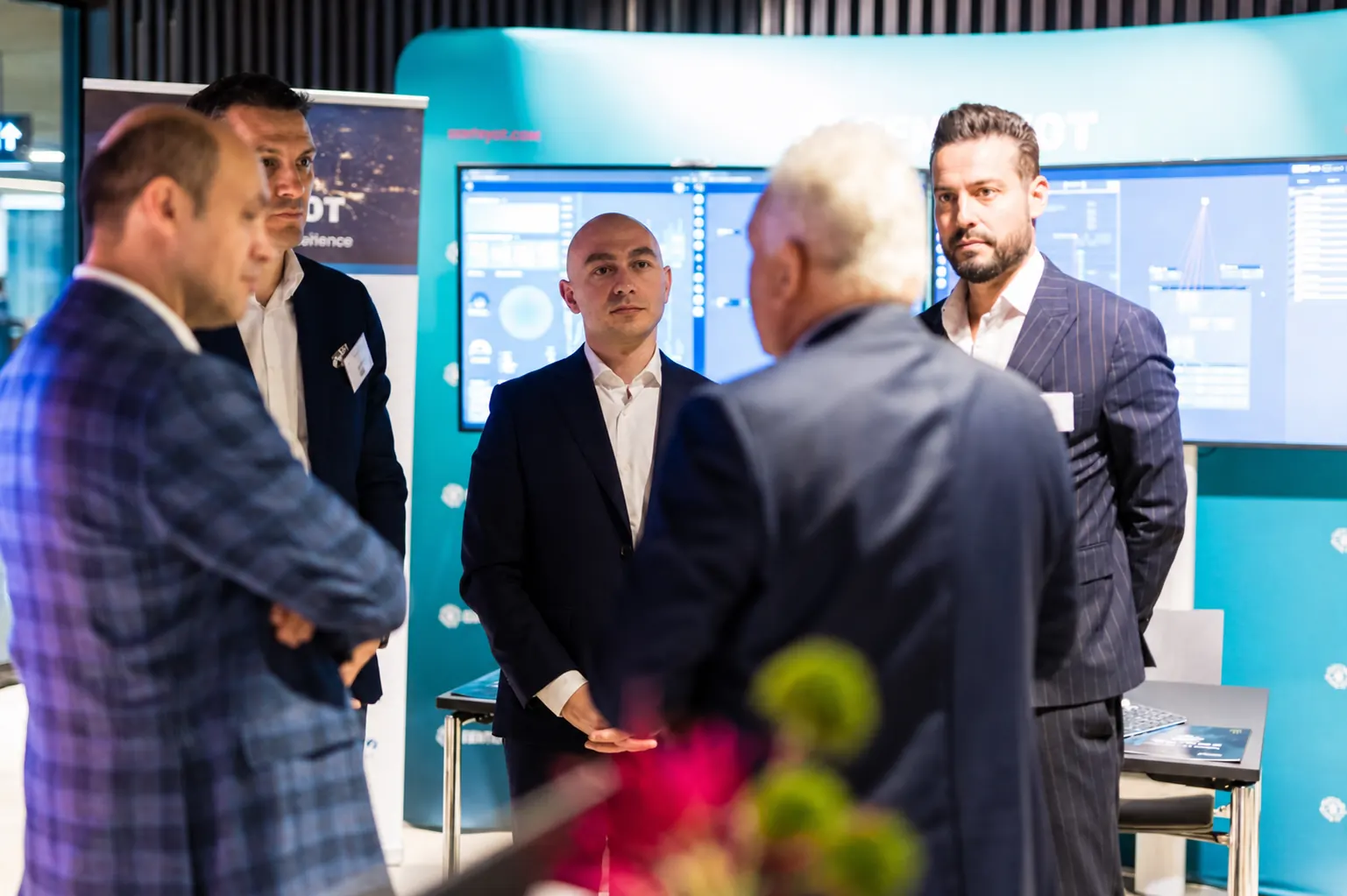 SentryOT specialists discussing operational cybersecurity at an industry event